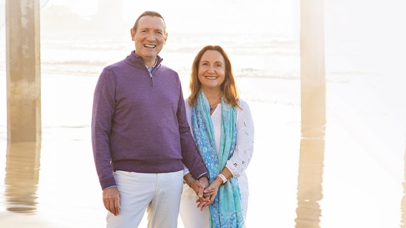 Photo of François Ferré, Ph.D., and Magda Marquet, Ph.D., in front of the Scripps Pier in La Jolla