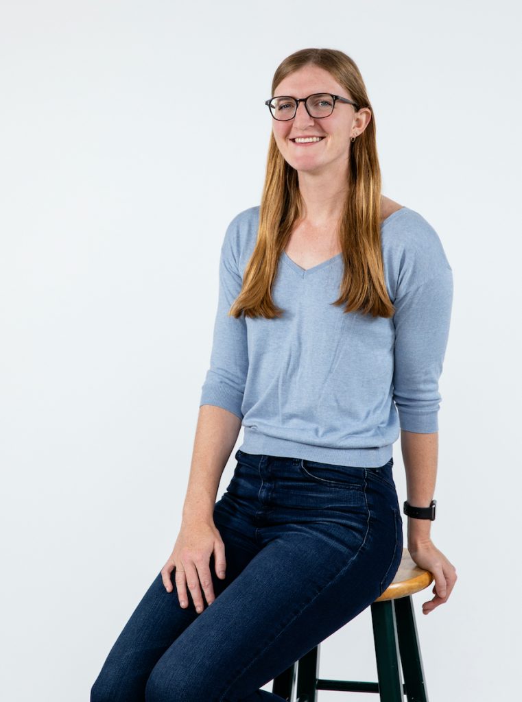 Portrait photo of Sloan Lewis. She smiles at the camera