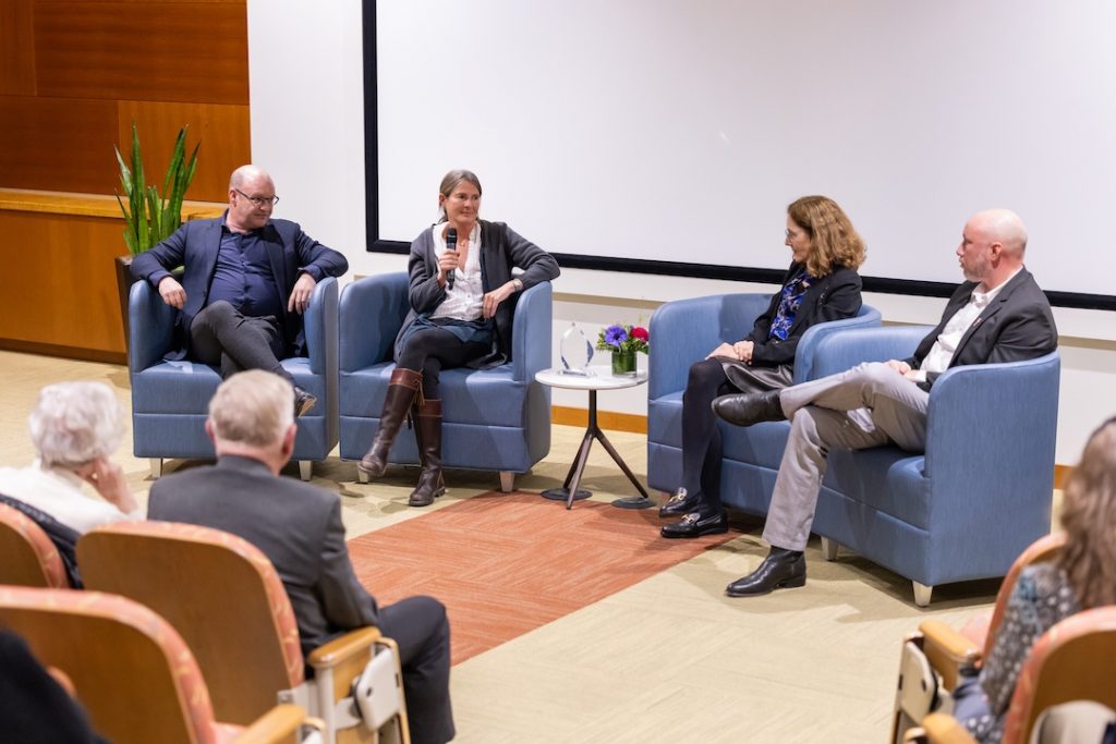 Panelists at the front of the LJI seminar room