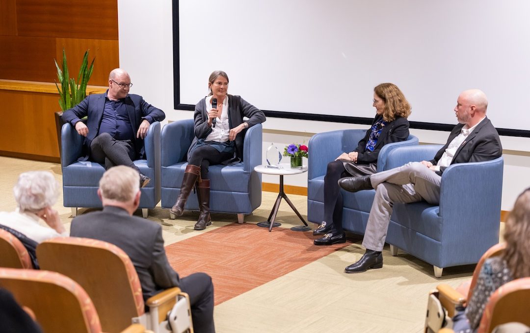 Panelists at the front of the LJI seminar room