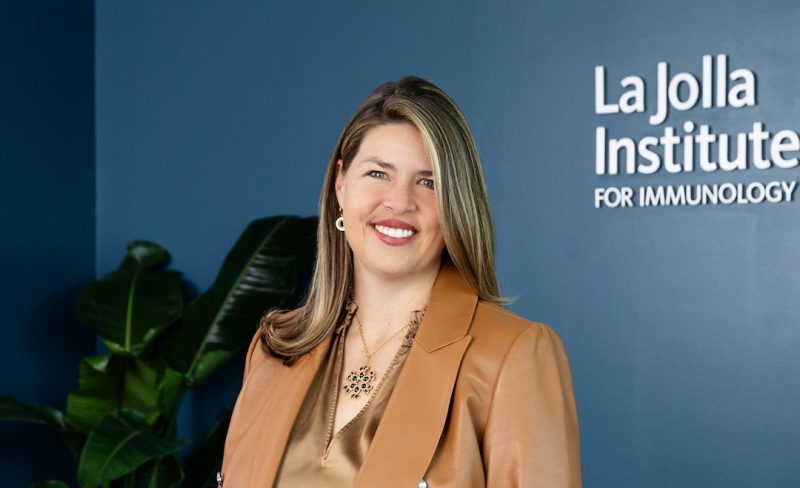 Portrait photo of Dr. Erica Ollmann Saphire in her office