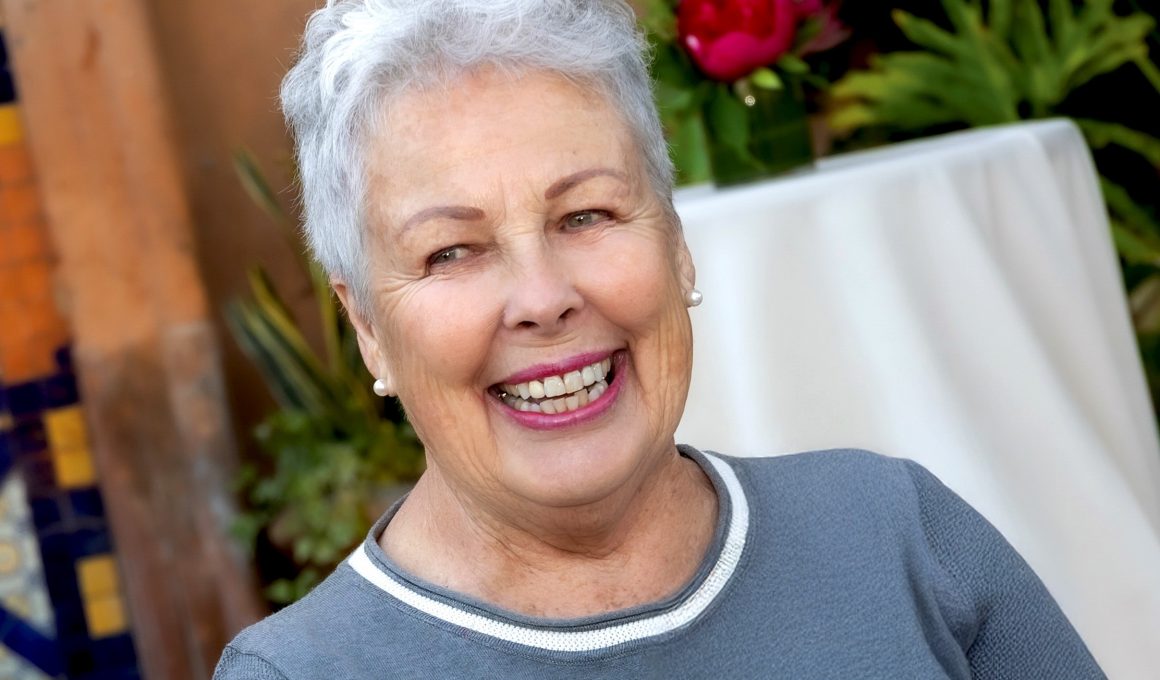 Photo of Marla Hess at an event. She is outside and smiling.