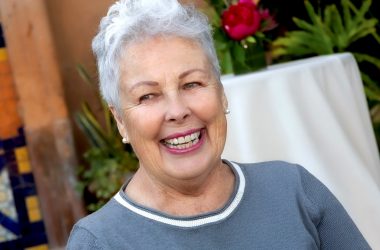 Photo of Marla Hess at an event. She is outside and smiling.